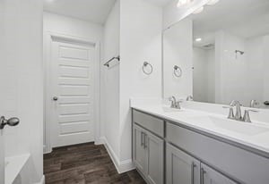 440 Bryan Street Angleton, TX 77515 - Photo 13 of 15 a bathroom with a sink and a mirror