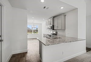 440 Bryan Street Angleton, TX 77515 - Photo 5 of 15 a kitchen with stainless steel appliances granite countertop a sink stove and cabinets