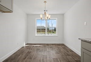 440 Bryan Street Angleton, TX 77515 - Photo 7 of 15 a view of a room with wooden floor cabinets and a window