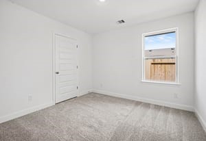 440 Bryan Street Angleton, TX 77515 - Photo 9 of 15 an empty room with a window