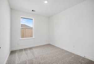 440 Bryan Street Angleton, TX 77515 - Photo 10 of 15 an empty room with a window