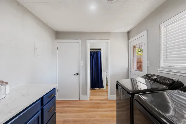 a kitchen that has a sink and a table in it