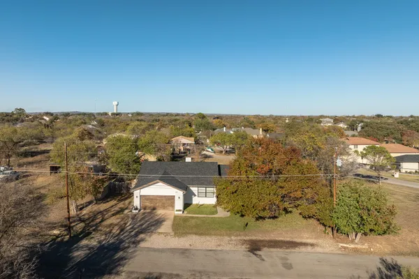 an aerial view of residential house and parking space