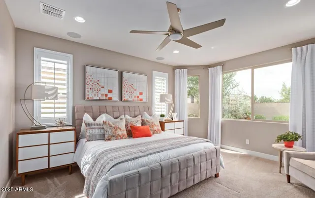 a bedroom with a bed and a window