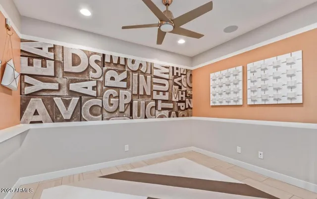 a view of a room with window and ceiling fan