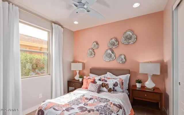 a bedroom with a bed and a window