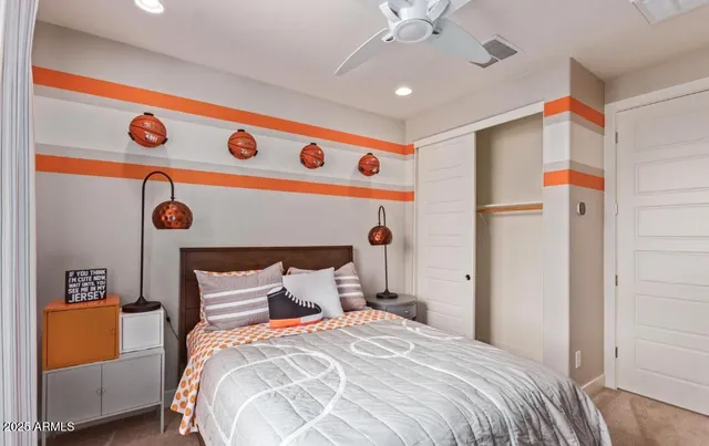 a bedroom with a bed and a dresser