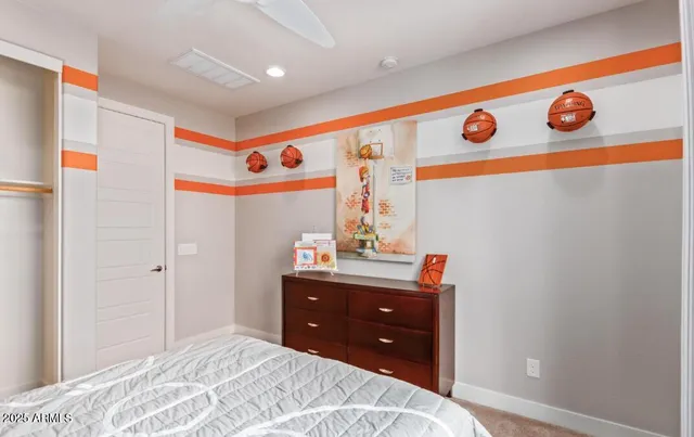 a bedroom with a bed and a table in it