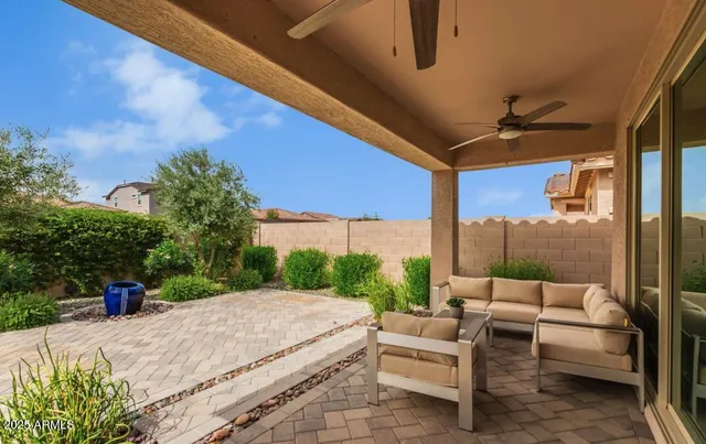 a balcony with furniture and a potted plant
