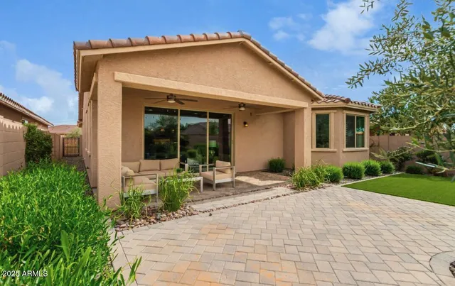 a front view of a house with garden and porch