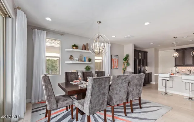 a view of a dining room with furniture window and outside view