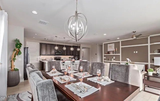 a living room with lots of furniture and kitchen view