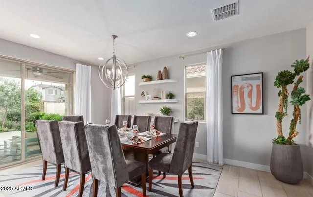 a view of a dining room with furniture window and outside view