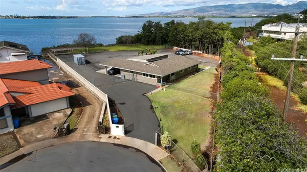 an aerial view of a house with a yard
