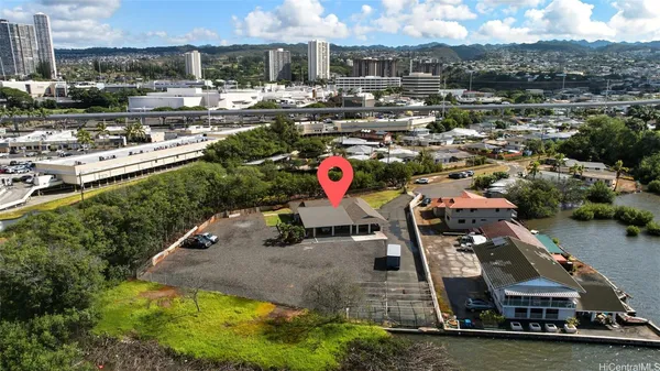 an aerial view of a house with a yard