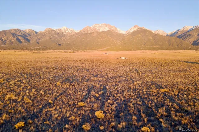 a view of an ocean from a mountain