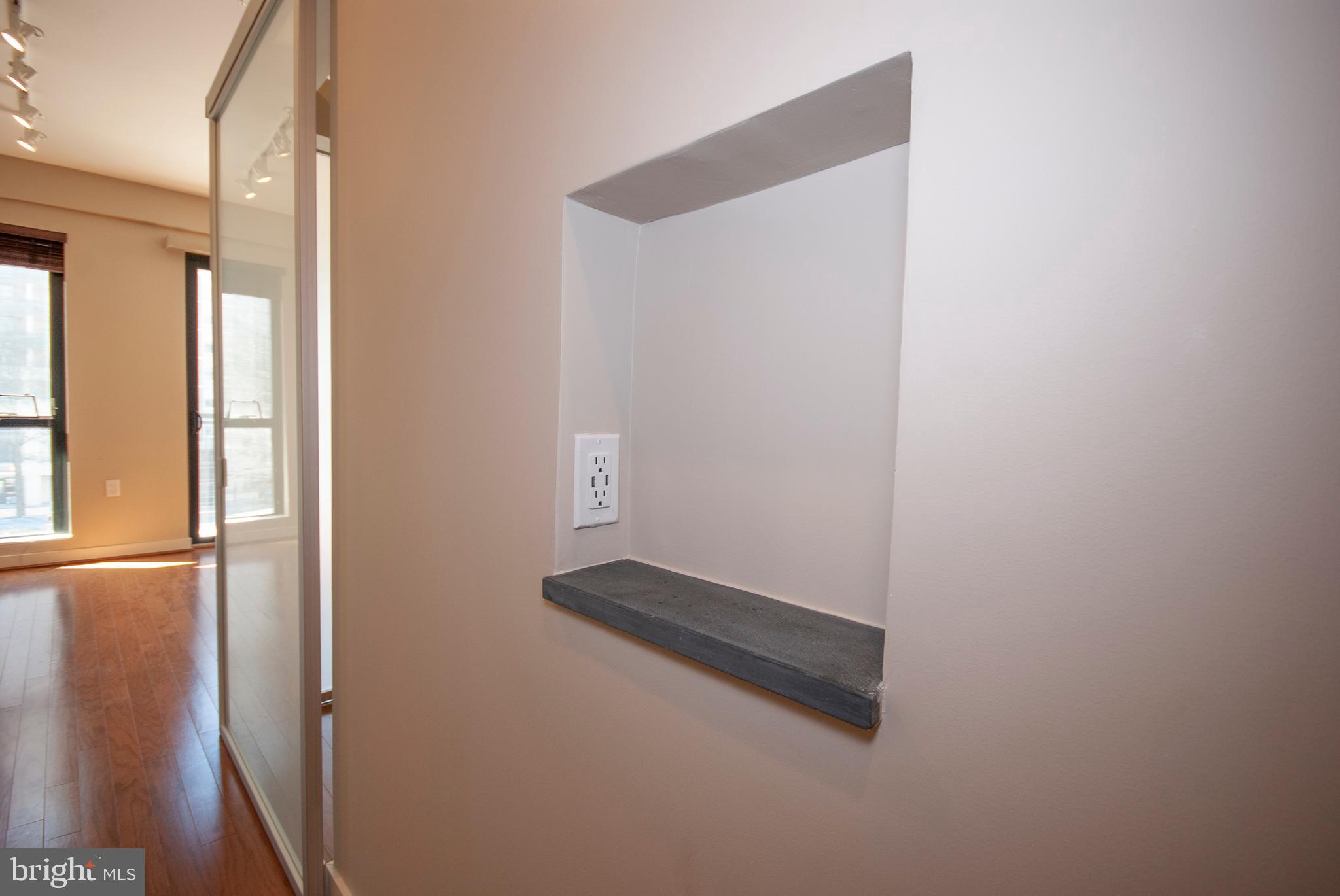 1320 Fenwick Lane, Unit 307 Silver Spring, MD 20910 - Photo 16 of 35 Charging nook in entry hallway