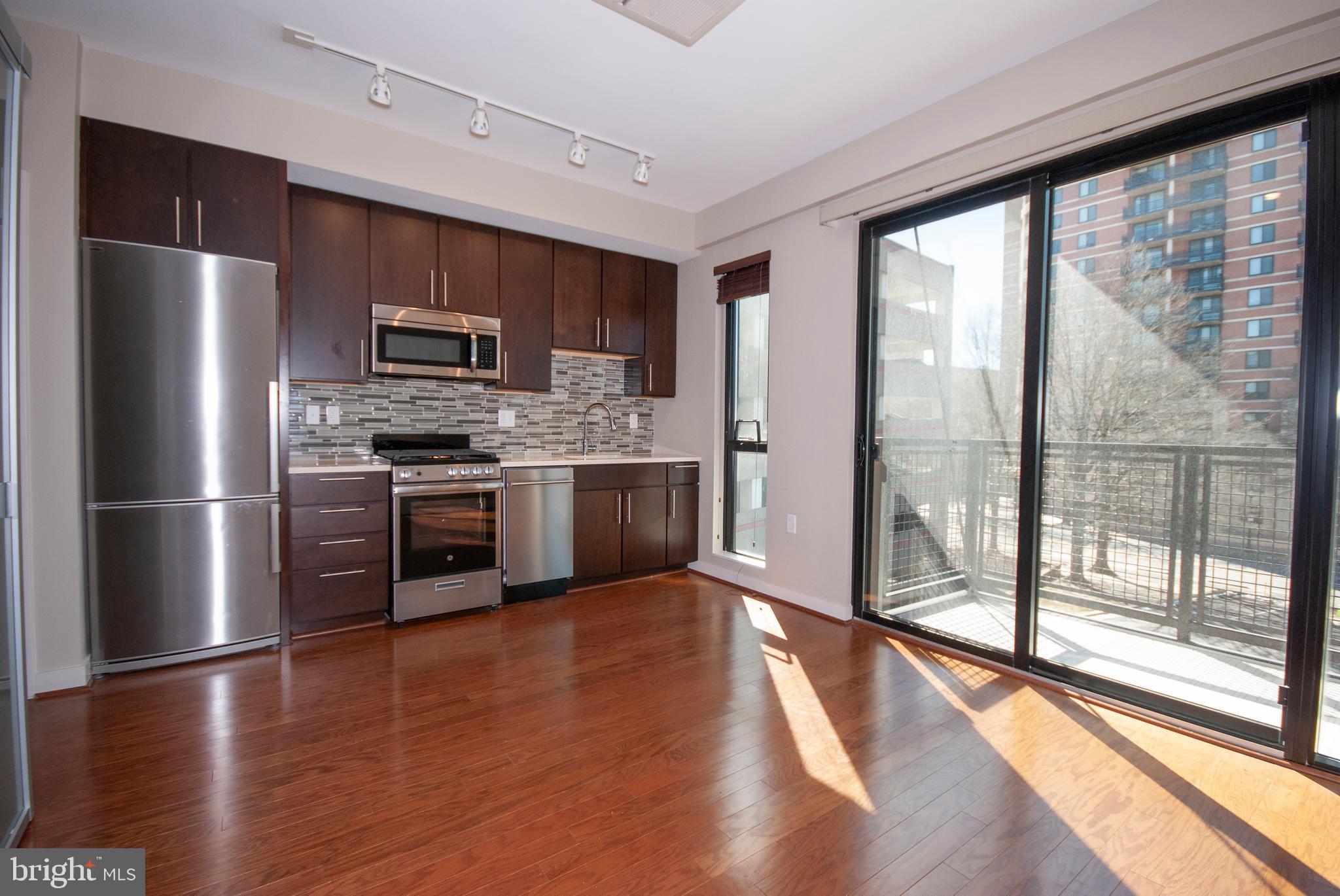 1320 Fenwick Lane, Unit 307 Silver Spring, MD 20910 - Photo 18 of 35 Living Area and Kitchen