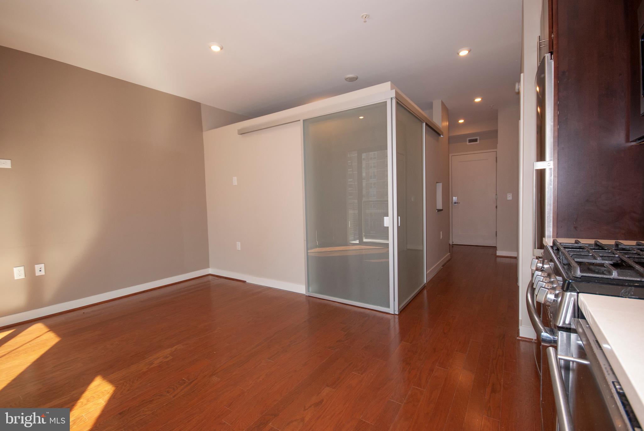 1320 Fenwick Lane, Unit 307 Silver Spring, MD 20910 - Photo 22 of 35 Living Area, Bedroom doors