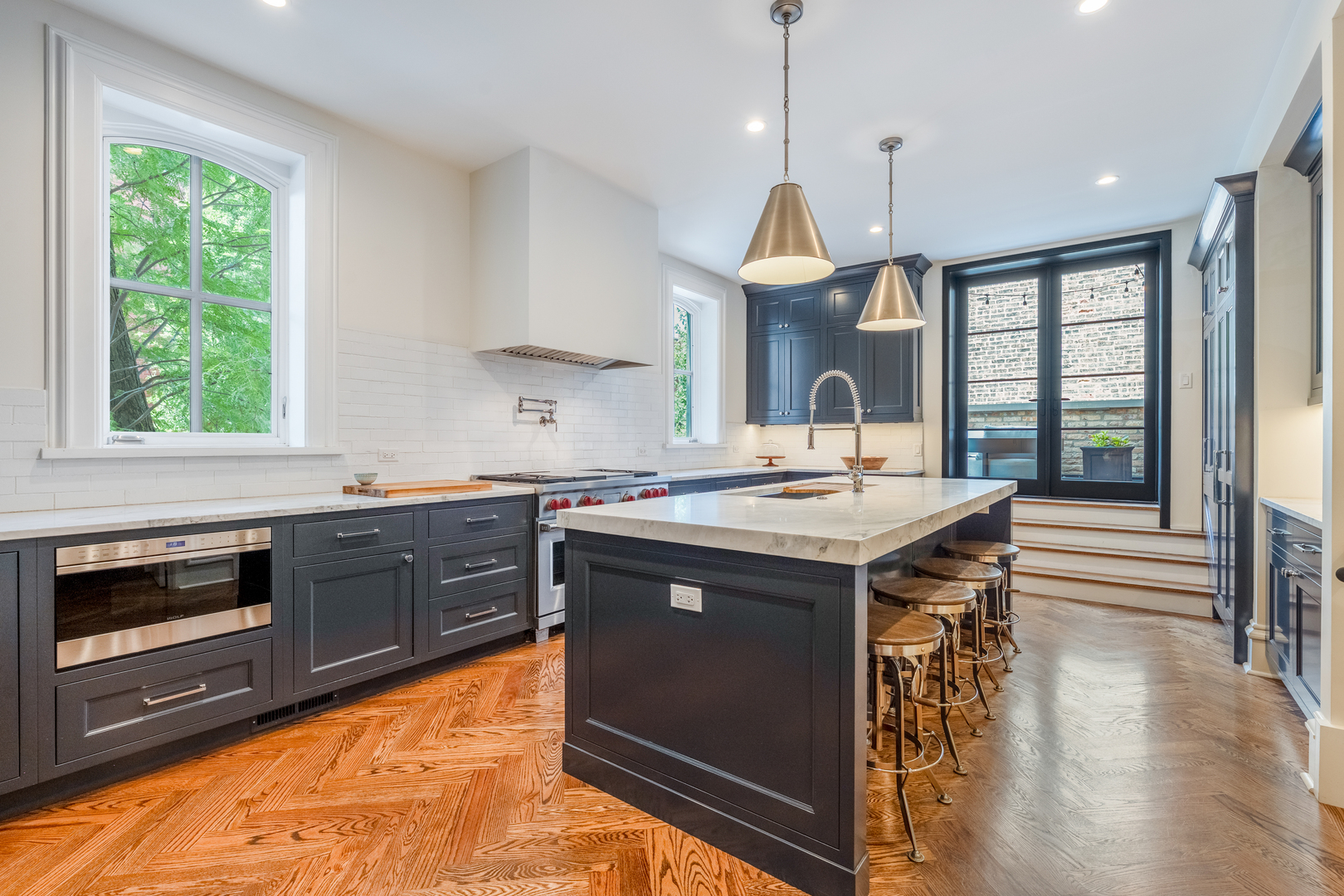558 West Belden Avenue Chicago, IL 60614 - Photo 19 of 62 a kitchen with a sink stove and cabinets
