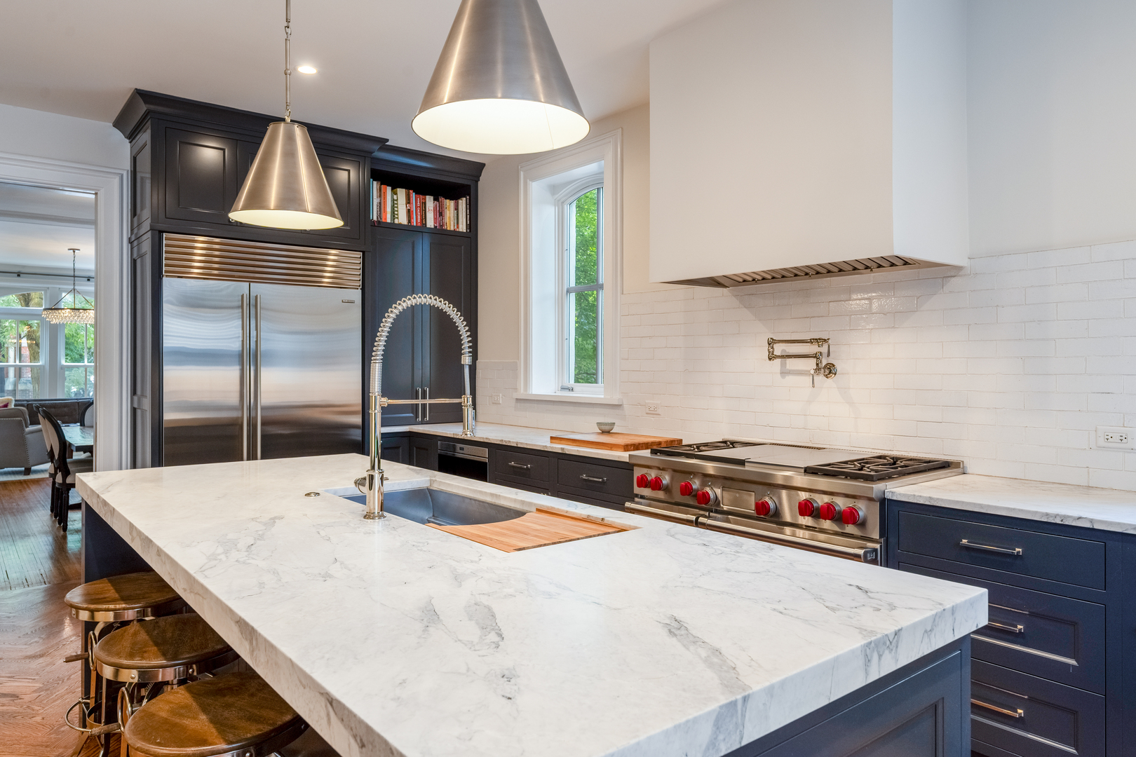 558 West Belden Avenue Chicago, IL 60614 - Photo 23 of 62 a kitchen with stainless steel appliances a sink a stove and a refrigerator