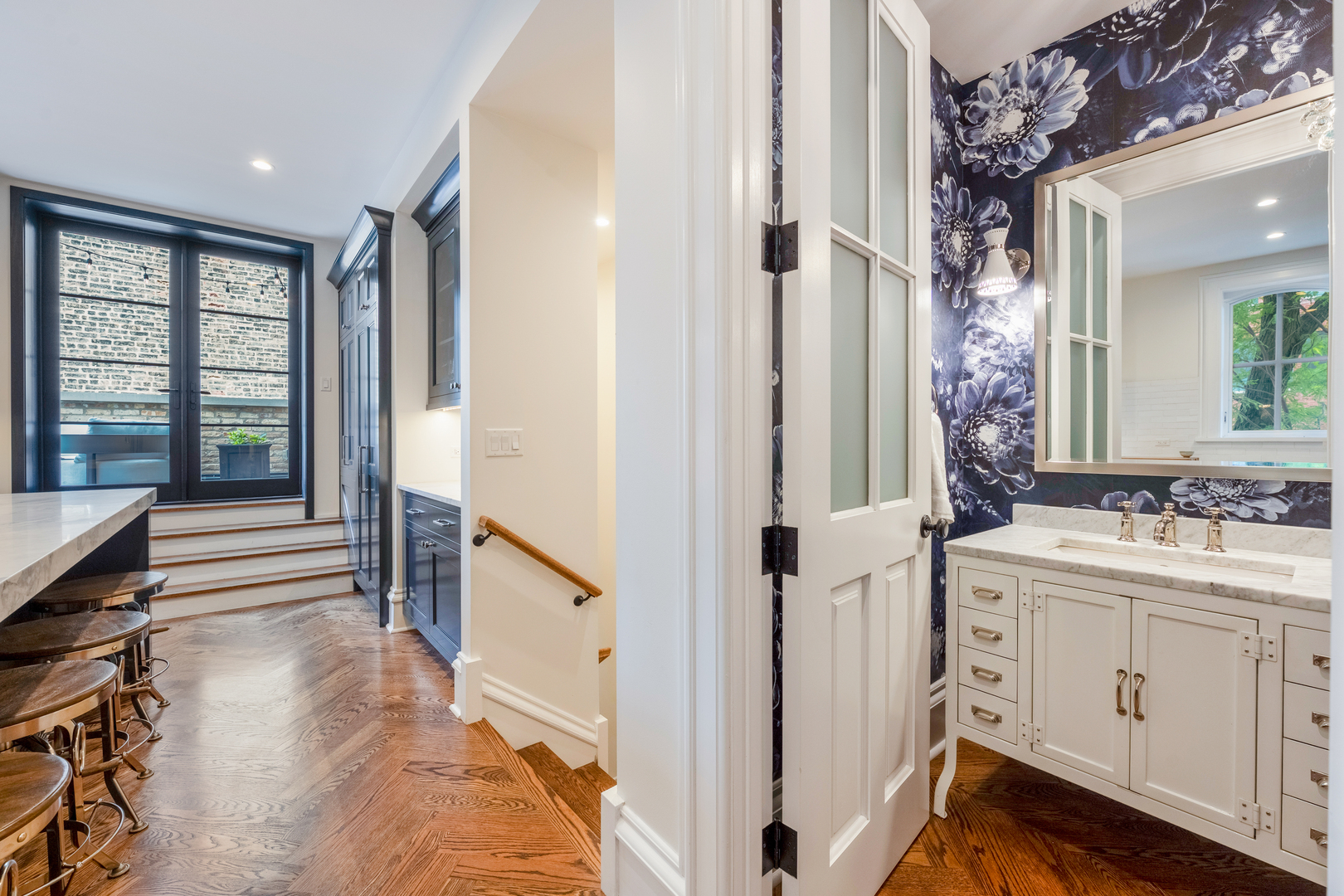 558 West Belden Avenue Chicago, IL 60614 - Photo 29 of 62 a view of a bathroom with a sink and mirror with wooden floor