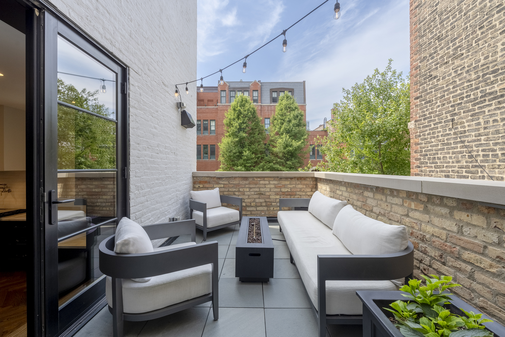 558 West Belden Avenue Chicago, IL 60614 - Photo 32 of 62 a balcony with couple of chairs and a potted plant