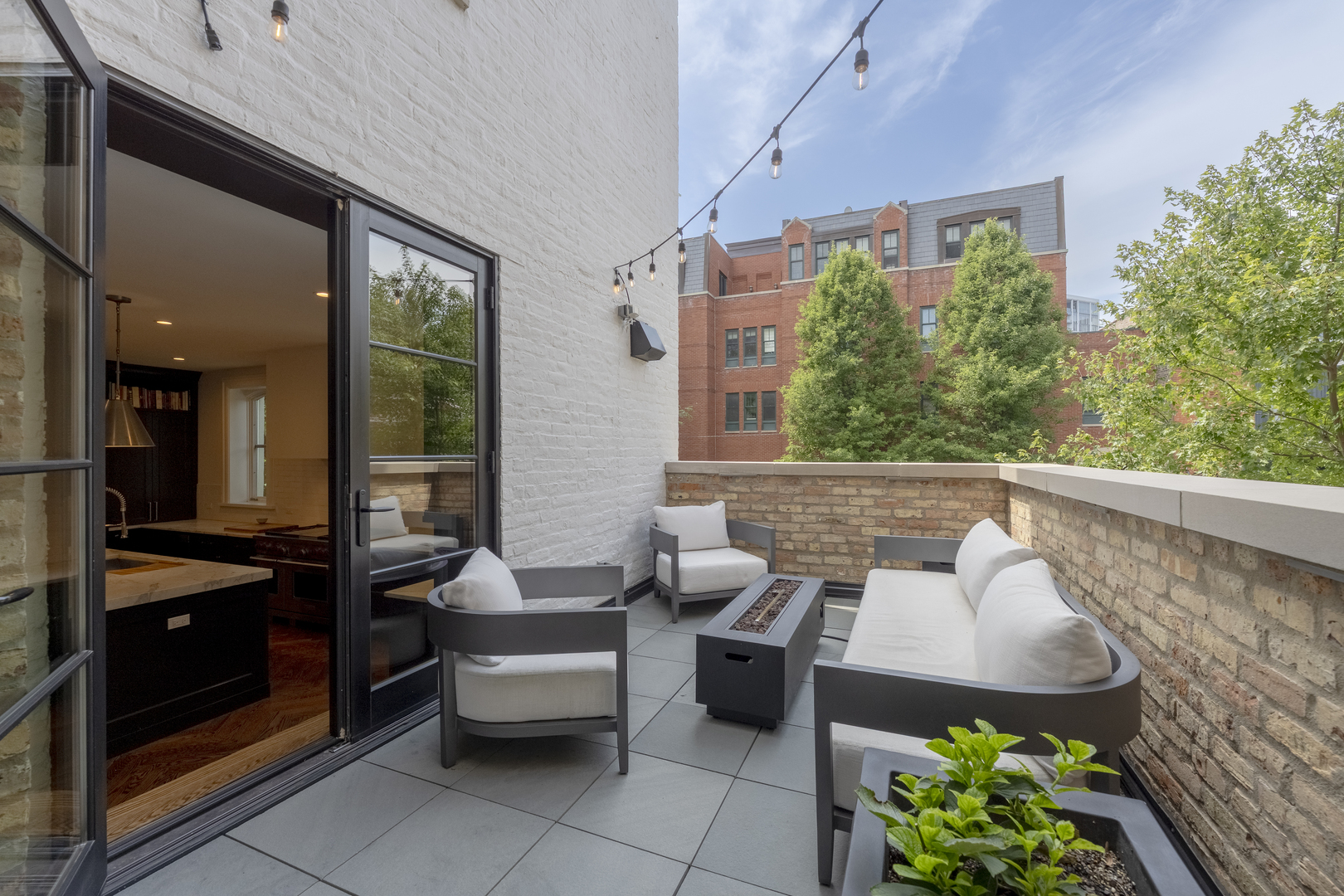 558 West Belden Avenue Chicago, IL 60614 - Photo 33 of 62 a balcony with furniture and a potted plant