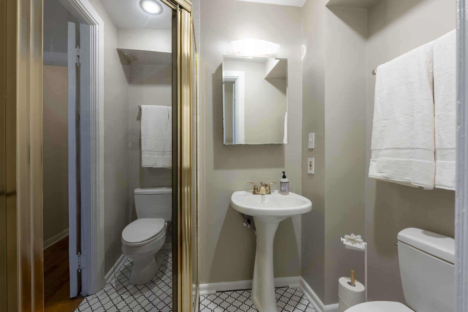 558 West Belden Avenue Chicago, IL 60614 - Photo 42 of 62 a bathroom with a toilet sink and mirror