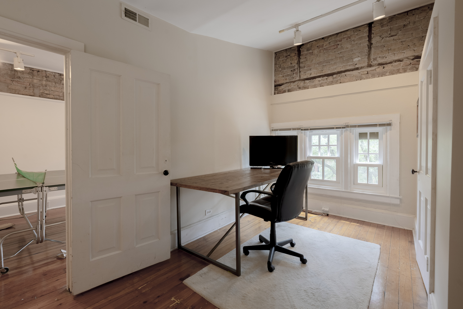 558 West Belden Avenue Chicago, IL 60614 - Photo 53 of 62 a view of a workspace with furniture and a window
