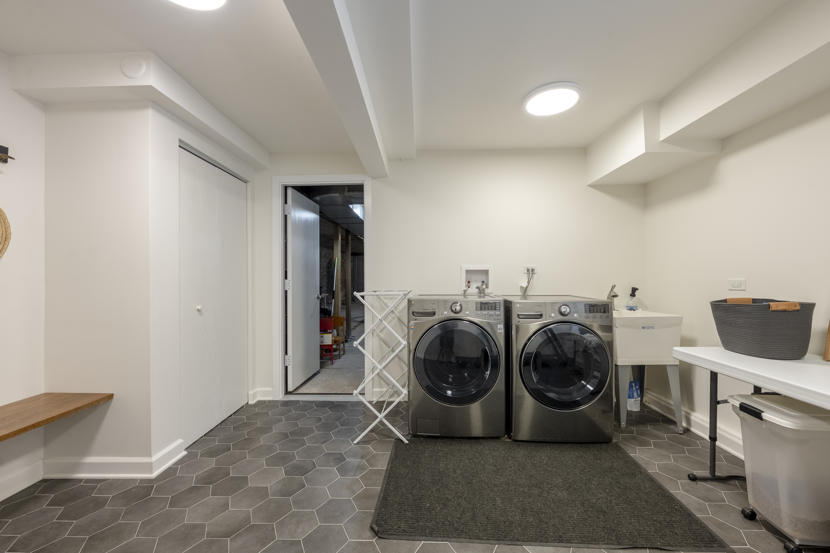 558 West Belden Avenue Chicago, IL 60614 - Photo 55 of 62 a view of a storage and utility room with washer and dryer
