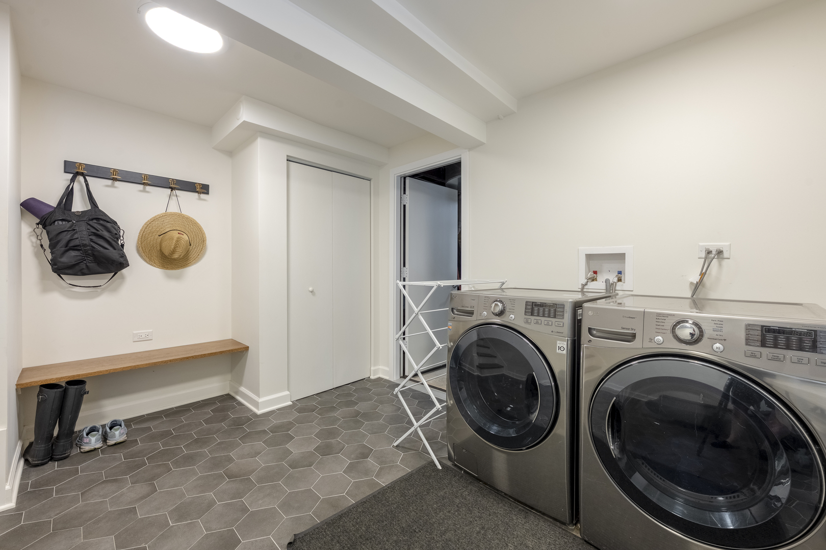 558 West Belden Avenue Chicago, IL 60614 - Photo 56 of 62 a view of a storage & utility room with washer and dryer