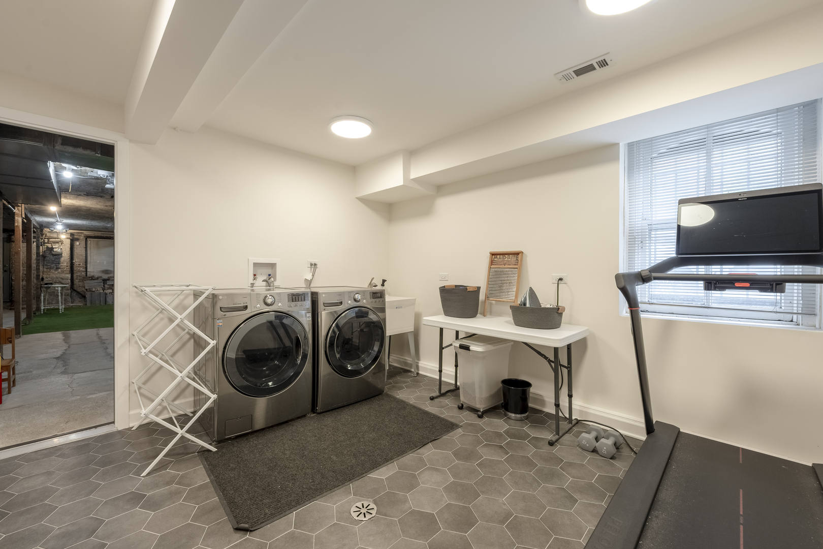 558 West Belden Avenue Chicago, IL 60614 - Photo 58 of 62 a view of a storage & utility room with washer and dryer