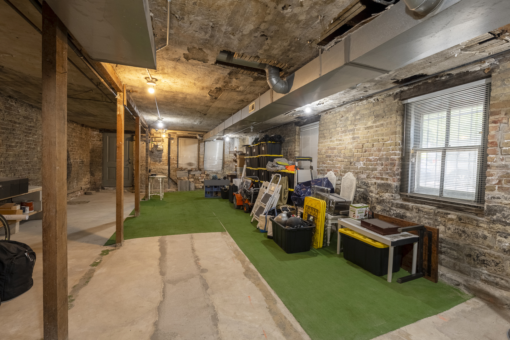 558 West Belden Avenue Chicago, IL 60614 - Photo 62 of 62 a view of a porch with furniture and a garage
