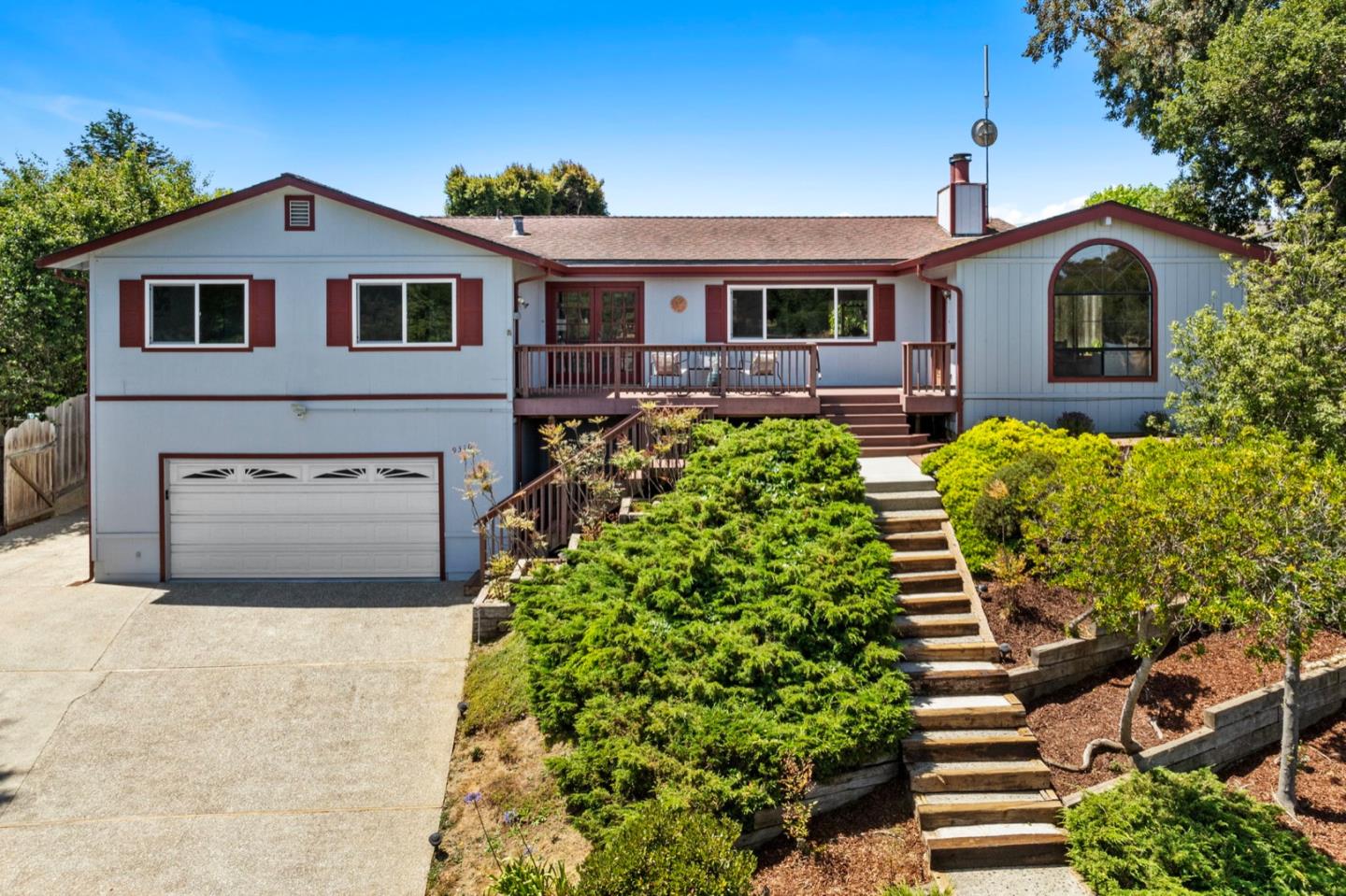 9310 Canyon Oak Road Salinas, CA 93907 - Photo 1 of 81 a front view of a house with a yard and garage