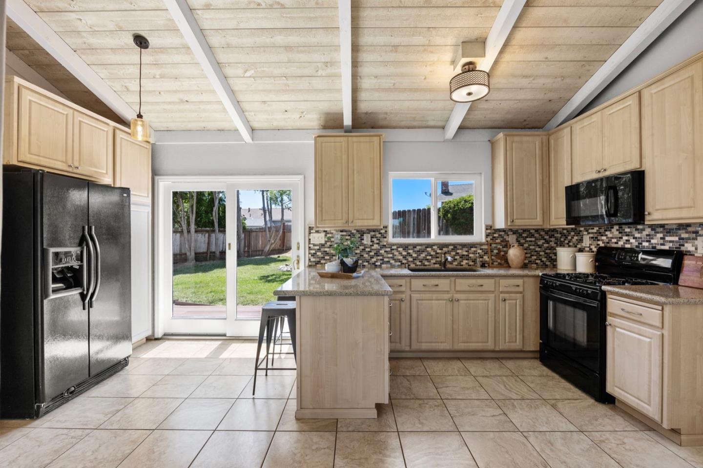 9310 Canyon Oak Road Salinas, CA 93907 - Photo 14 of 81 a kitchen with a sink stainless steel appliances and cabinets