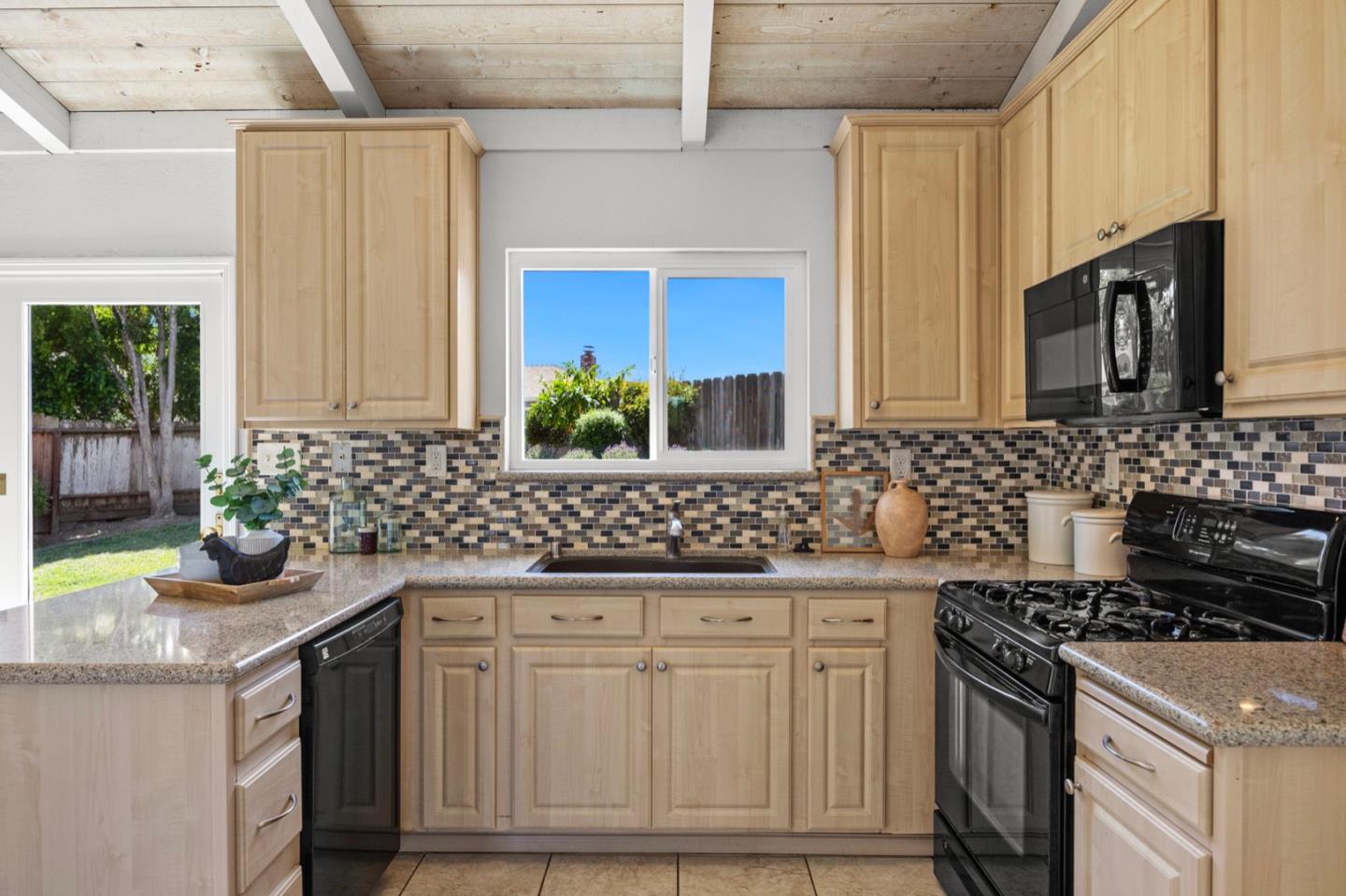 9310 Canyon Oak Road Salinas, CA 93907 - Photo 17 of 81 a kitchen with stainless steel appliances granite countertop a sink stove and cabinets