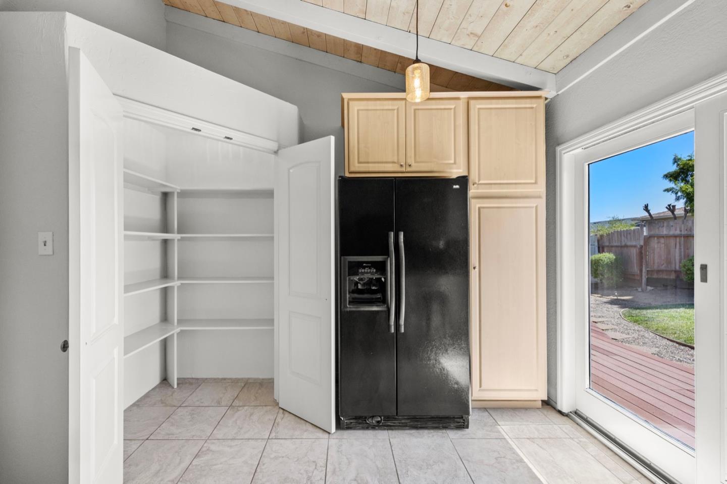 9310 Canyon Oak Road Salinas, CA 93907 - Photo 19 of 81 a view of a refrigerator in kitchen and an empty room