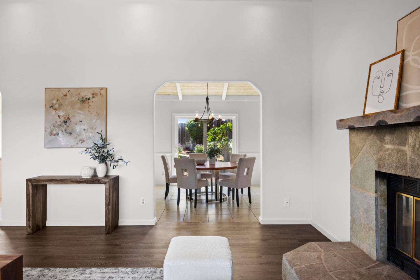 9310 Canyon Oak Road Salinas, CA 93907 - Photo 28 of 81 a dining room with furniture wooden floor a fireplace and a chandelier