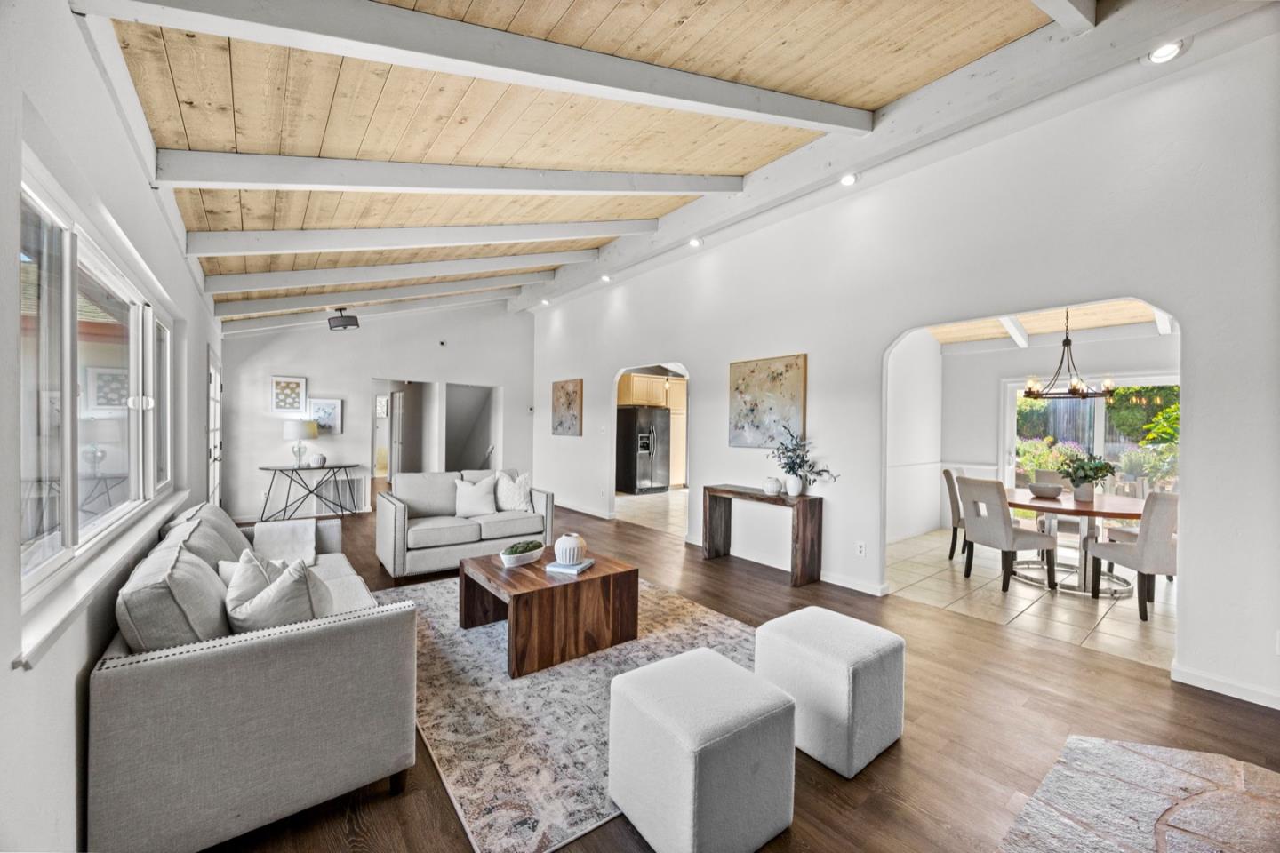 9310 Canyon Oak Road Salinas, CA 93907 - Photo 32 of 81 a living room with couches and a dining table with wooden floor