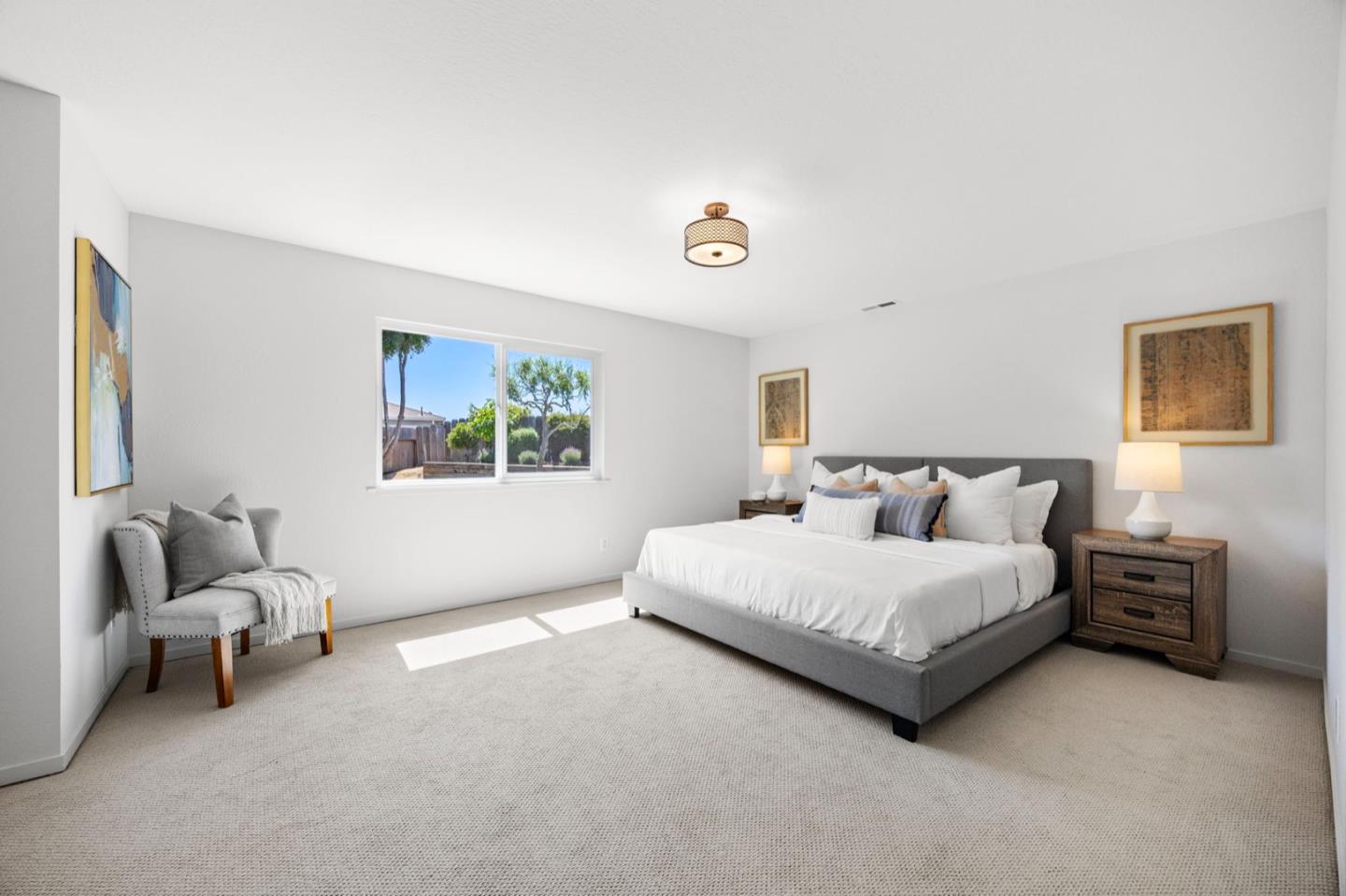 9310 Canyon Oak Road Salinas, CA 93907 - Photo 47 of 81 a spacious bedroom with a bed and a couch