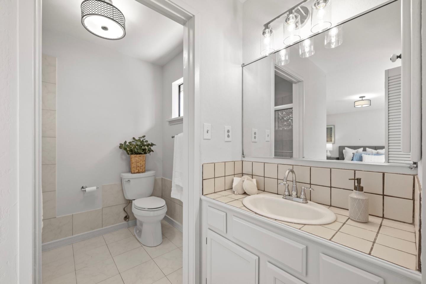 9310 Canyon Oak Road Salinas, CA 93907 - Photo 52 of 81 a bathroom with a sink a toilet and shower