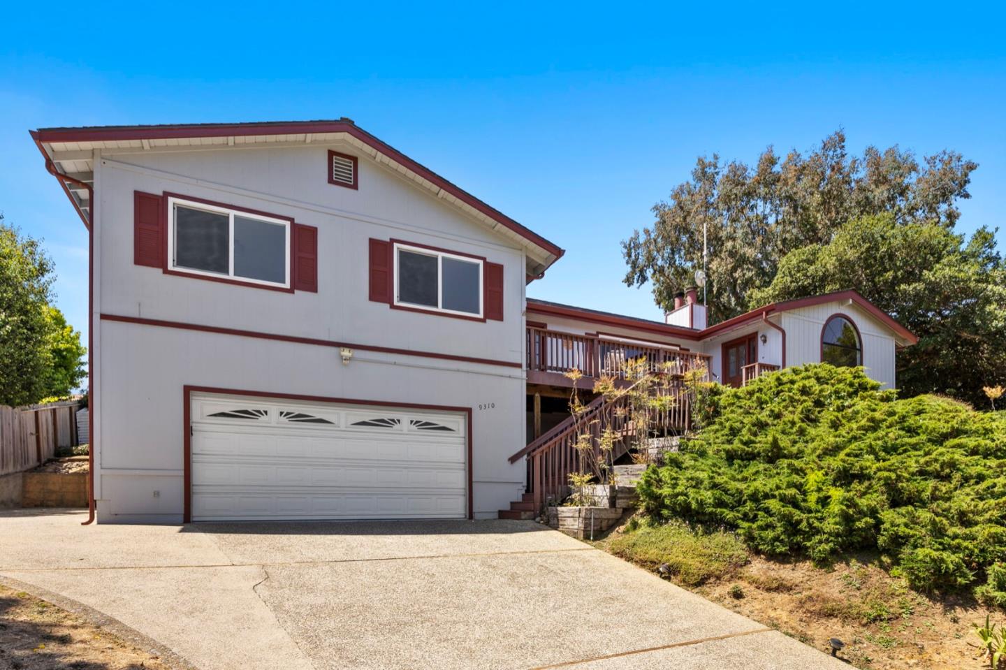 9310 Canyon Oak Road Salinas, CA 93907 - Photo 72 of 81 a front view of a house with a yard and garage