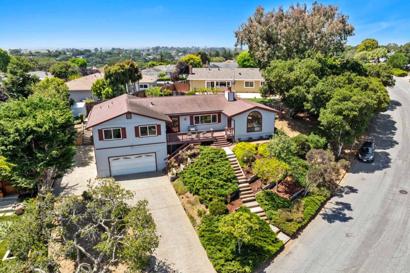 9310 Canyon Oak Road Salinas, CA 93907 - Photo 76 of 81 an aerial view of a house with a garden and trees