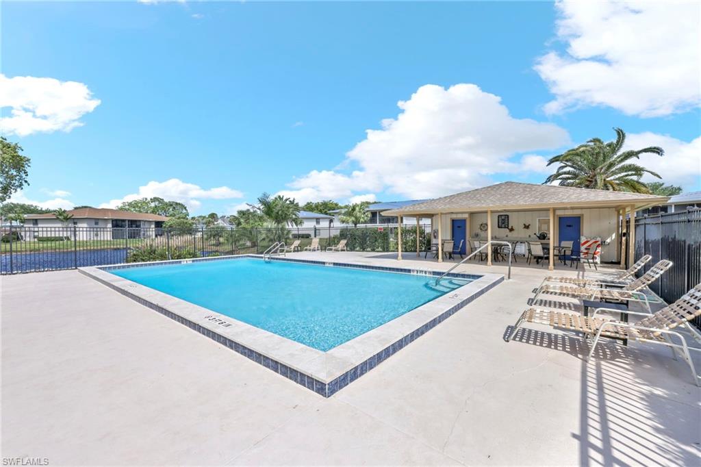 151 Cypress Way East, Unit C103 Naples, FL 34110 - Photo 27 of 29 a view of outdoor space yard and patio