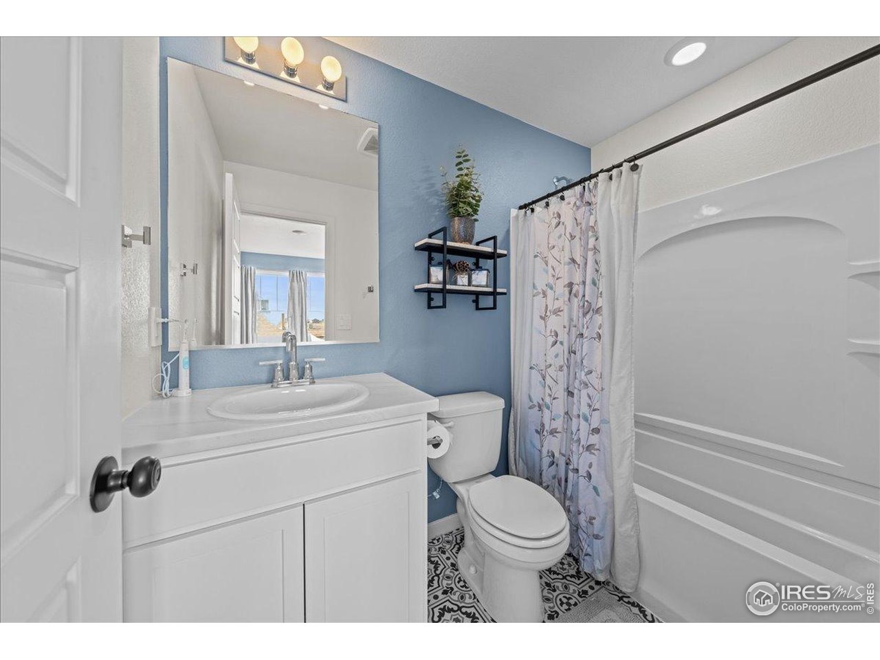 341 Cardinal Street Johnstown, CO 80534 - Photo 11 of 21 a bathroom with a sink a toilet and shower