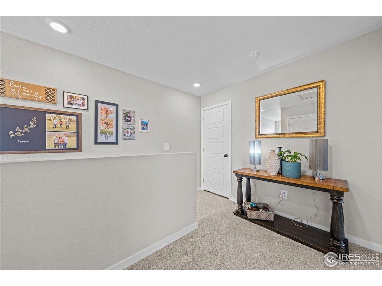 341 Cardinal Street Johnstown, CO 80534 - Photo 12 of 21 a room with painting on the wall and a window