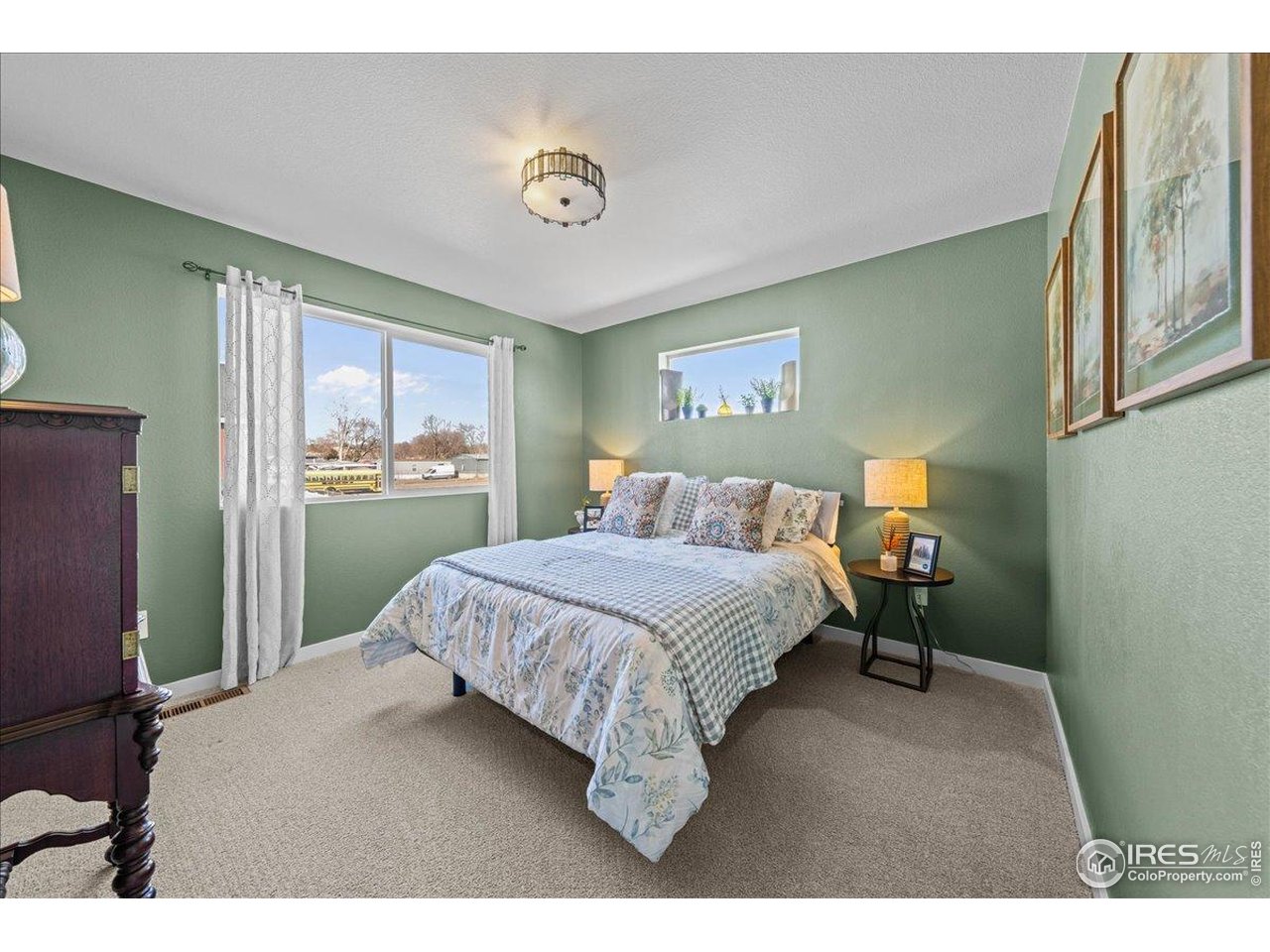 341 Cardinal Street Johnstown, CO 80534 - Photo 13 of 21 a bedroom with a bed and dresser