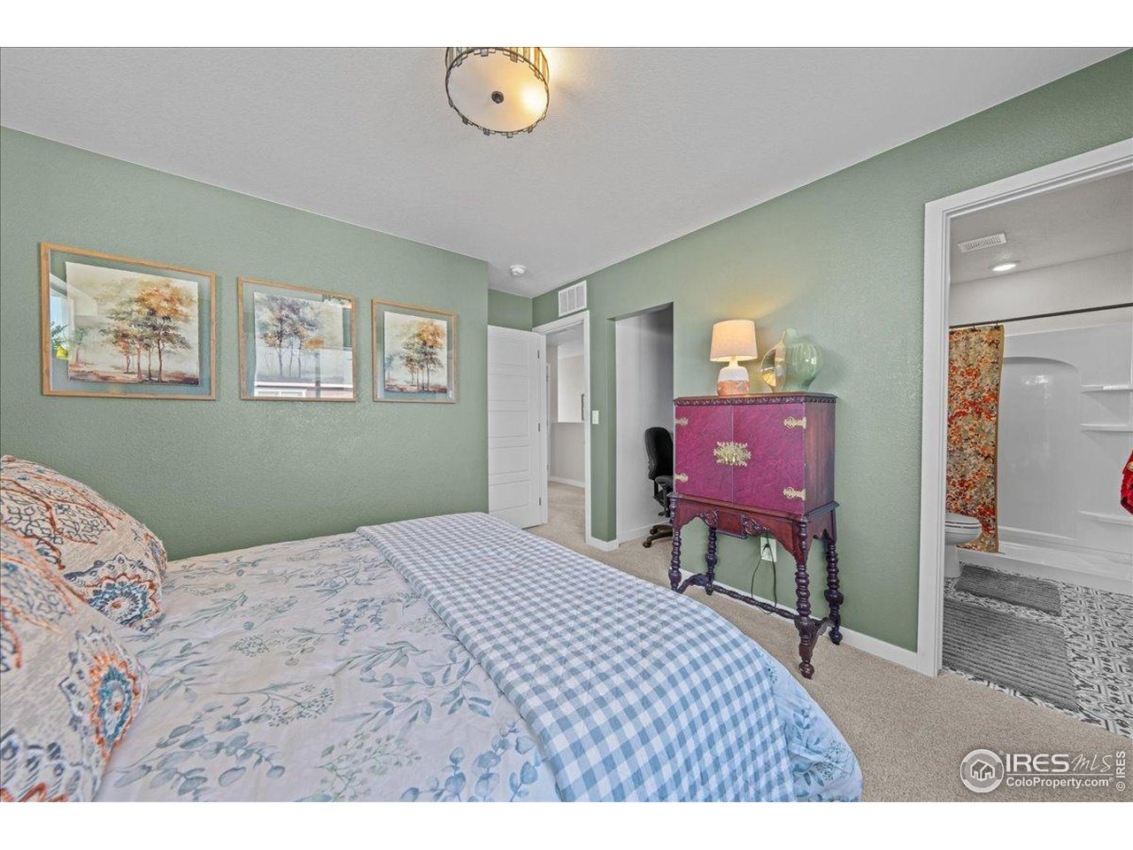 341 Cardinal Street Johnstown, CO 80534 - Photo 14 of 21 a bedroom with a bed and wooden floor