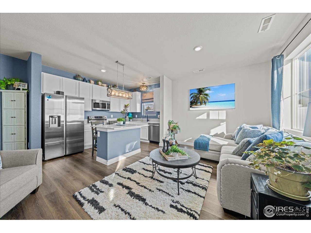 341 Cardinal Street Johnstown, CO 80534 - Photo 19 of 21 a kitchen with a table and chairs